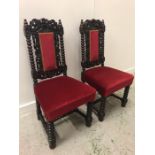 A Pair of Victorian chairs with scroll carved sides on bobbin turned legs.