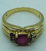 A Ruby and diamond ring on a 10 ct yellow gold setting