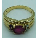 A Ruby and diamond ring on a 10 ct yellow gold setting