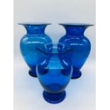 Three cobalt blue Royal Copenhagen urn shaped vases. One 20cms tall, the others 15cms tall.