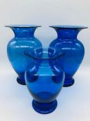 Three cobalt blue Royal Copenhagen urn shaped vases. One 20cms tall, the others 15cms tall.