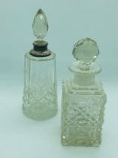 Two cut glass scent bottles, one with a silver collar