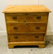 A Three drawer pine chest of drawers