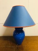 A Blue glass lamp base and shade.