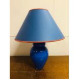 A Blue glass lamp base and shade.