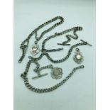 A Selection of silver watch chains and pendants. (208g)