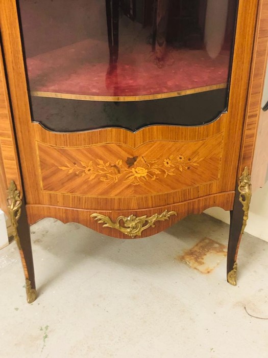 An Ornate corner cabinet with brass detailing, marquetry and a curved glass door and three shelves. - Image 4 of 5