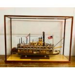 A glass case scratch built model of a paddleboat steamer 'King if Mississippi' (Case size W 75 cm