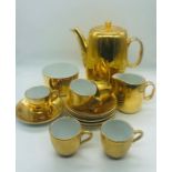 A Royal Worcester Coffee pot, sugar bowl and milk jug along with five coffee cups and six saucers