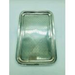 A small rectangular silver tray with rounded edges, hallmarked Birmingham, (Weight 305g 29cm x