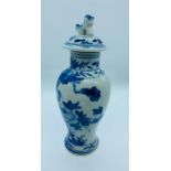 A Kangxi Period Chinese blue and white lidded vase with Foo Dog Finial.