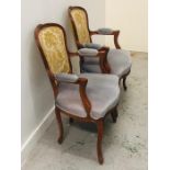 A Pair of large open armchairs with cabriole legs and duck egg blue upholstery