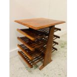 A Mid Century rosewood magazine rack.