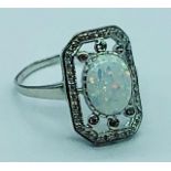 A Silver CZ and Large Central Opal Panelled Ring