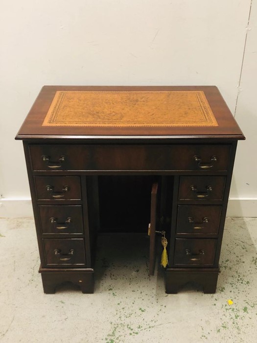 Small Tan Leather Topped lockable Desk With Three Small Drawers Each Side, One Top Drawer and a