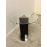 A Contemporary glass topped table on a chrome base and lacquered base.