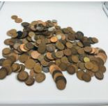 A selection of coins mainly pennies, various years and denominations.