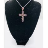 A Silver and Amethyst Crucifix Necklace on Silver Chain