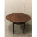 An Oval drop leaf table on tapered legs with castors and a drawer at one end H 73cm x W 120cm x D