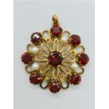 A 9ct gold pendant with semi precious stones (4.7g)