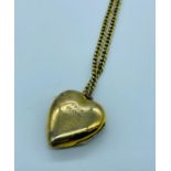 A 9ct yellow gold heart pendant on a 9ct chain (7.4g)