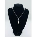 A Silver CZ and Pear Shaped Fresh Water Pearl Pendant Necklace