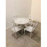 A Wrought Iron white garden table with four chairs.