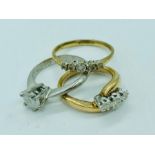 Three 9ct gold rings, various settings and stones (7.1g)