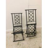 A Pair of Black Wrought Iron Folding Garden Chairs