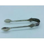 A pair of silver sugar tongs, hallmarked Sheffield 1973 by CB & S