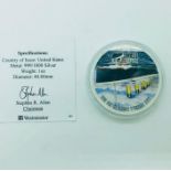 A 1oz silver proof coin commemorating the RMS Titanic Maiden Voyage.