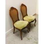 A Pair of hall chairs with reed backs, cabriole legs and lime green upholstered seats.