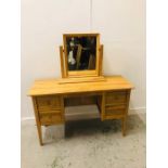 A Contemporary Oak dressing table with four small drawers, dressing table mirror (H 79cm x W 126cm x