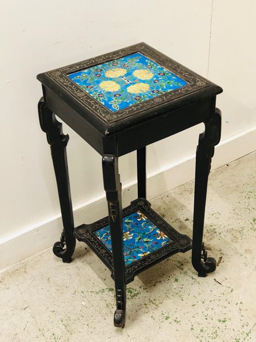 An ebonised pot stand with tiled top and lower shelf. - Image 2 of 2