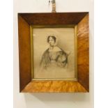 A framed portrait in pencil of Harriet Bevin by T Sampson