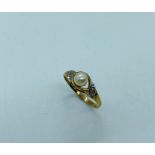 A pearl ring in a 9ct gold setting