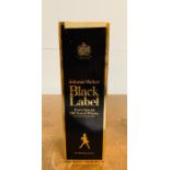 A Boxed 1litre Bottle of Johnnie Walker Black Label with Duty Free Label still intact