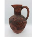 Chinese purple clay jug with embossed Dragon