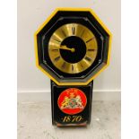 A Reproduction wall clock with Victorian coat of arms.