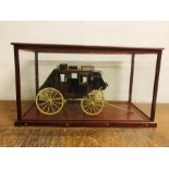 A Cased model of a scratch built US Mail Stagecoach (Case is 69cm W x 38 cm H x 34cm D)