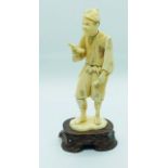 A 19th Century Japanese Ivory Figure of a Scholar on Wooden Base