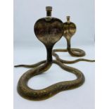 Two snake themed Brass candlesticks.