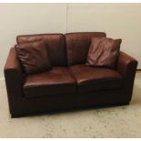 Brown Two seater sofa with leather stitched