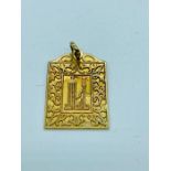 A 18ct yellow gold Koran pendant (5.1g)