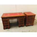 A pedestal desk with re leather inlay and matching filing unit.