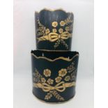 Two metal flower baskets with a gilt flower design to front