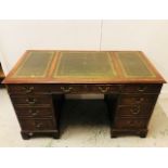 A Mahogany Double Sided Twin Pedestal Desk on Bracket Feet