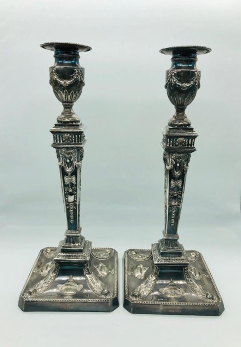 A Pair of silver candlesticks, hallmarked Sheffield 1968 with makers mark J D & S, James Dixon and