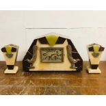 An Art Deco clock and Garniture