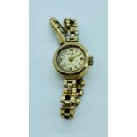 A Rotary Ladies 9ct gold watch (9.8g) no glass in face.